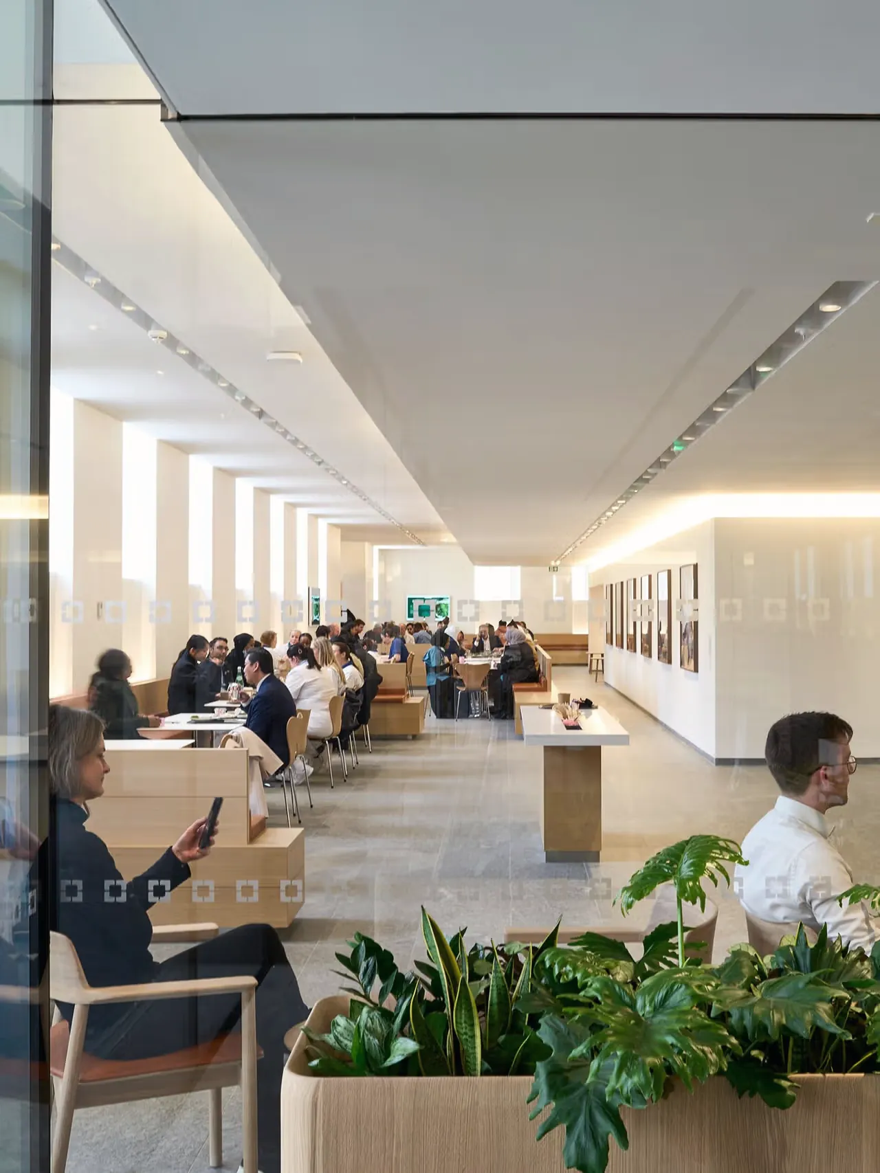 Patients and visitors in a waiting area at Cleveland Clinic London.
