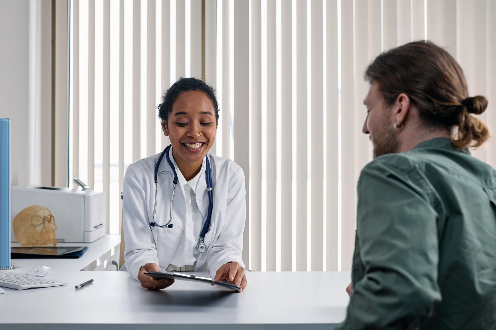 A doctor in conversation with a patient.